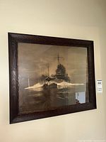 Full view of framed photograph on wall showing image and frame