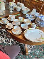 Overall lot with teacups, bowls, creamer, two platters