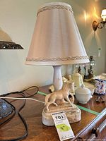 Full view of lamp with shade showing marble base, horse figure, cord