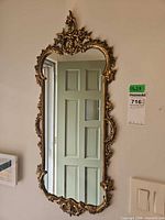 Front view showing full mirror and ornate frame