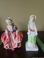 Front view of both figurines