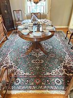 Full view of rug under dining table showing overall pattern and colors