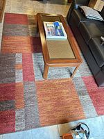 Full view of rug showing block pattern and colors