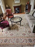 Full view of rug in living room showing overall pattern and fringe