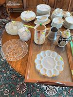 Overall lot showing tray, steins, pitcher, plates