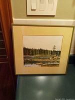 Full view of framed watercolor landscape