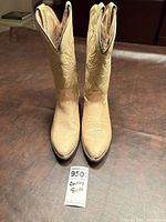 Front view of both boots standing upright showing toe shape, stitching and overall color