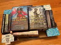 Top view of box containing multiple Cassandra Clare Shadowhunter novels in both hardcover and paperback formats
