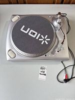 Top view showing platter, slipmat, tonearm and attached RCA cable