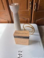 Lot overview: candle holder, gold spiral ring, Pampered Chef boxed set