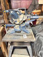Overall view of RONA miter saw on Craftsman stand