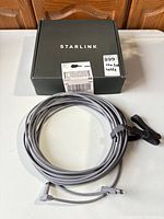 Coiled cable with Starlink branded box