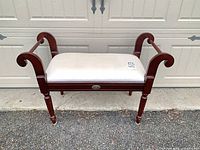 Front view of mahogany bench with ivory seat