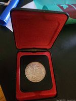 Coin seated in red-lined case