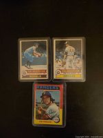 Fronts of three sleeved baseball cards: 1975 Topps Jim Fregosi, 1979 Topps AL All-Star Jim Palmer, 1979 Topps AL All-Star Royals
