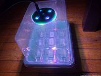 Kit assembled showing cell insert, dome, LED light on