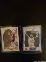 Both Michael Jordan cards in sleeves