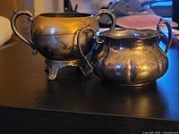 Front view of both sugar bowls side by side