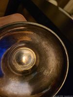 Bottom interior of teapot showing plating and mark