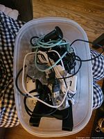 Top view of tub showing mixed cables and adapters