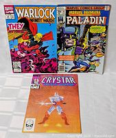 Front covers of all three comic books: Warlock and the Infinity Watch, Marvel Premiere #39 Paladin, Crystar the Crystal Warrior #3