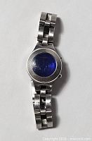 Front view of Fossil F2 watch showing blue dial and stainless bracelet