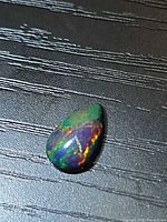Front view of pear cabochon showing play-of-color