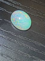Top view of opal showing pinfire colour