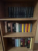 Full bookcase view showing all 36 Trollope hardcovers on three shelves