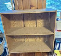 front view showing two shelves and three compartments