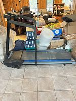 Left side profile of DP LP 6500 Transport treadmill folded down