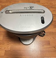 Top view showing feed slot, Fellowes logo, control icons