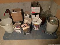 Assorted carboys, bucket, wine kit boxes, tubing