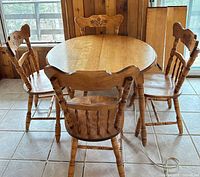 Table with four chairs around it