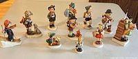 Group shot of all twelve porcelain figurines