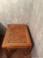 Top view showing parquet veneer pattern and brass trim