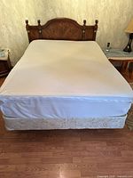 Full bed setup showing mattress, box spring and headboard