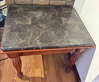 Top view showing black marble surface with white veining and stain