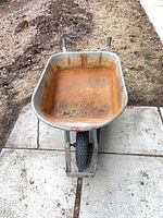 Top view showing rusted galvanized tray and wood handles