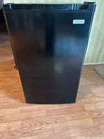 Front view of black Vissani compact fridge