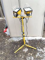Full view of dual-head work light on tripod