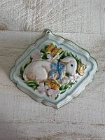 Full view of ceramic diamond-shaped lamb jello mold wall hanging