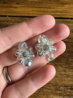 Front view of both earrings showing floral bead clusters