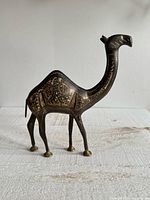 Full view of brass camel figurine standing