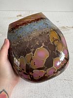 Front view of multicolored art glass vase