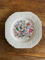 Full view of floral plate showing border and central design