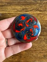 Front view of brooch showing full enamel pattern
