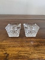 Pair of square clear glass tapered candle holders front view