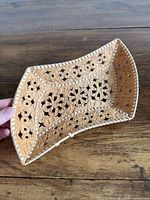 Top view of birch bark basket showing cut-outs and embossing