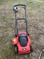 Full mower front view showing deck, wheels, motor cover